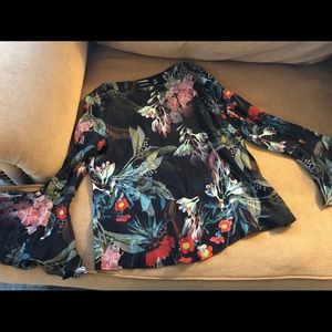 Woman’s floral top with flared sleeves